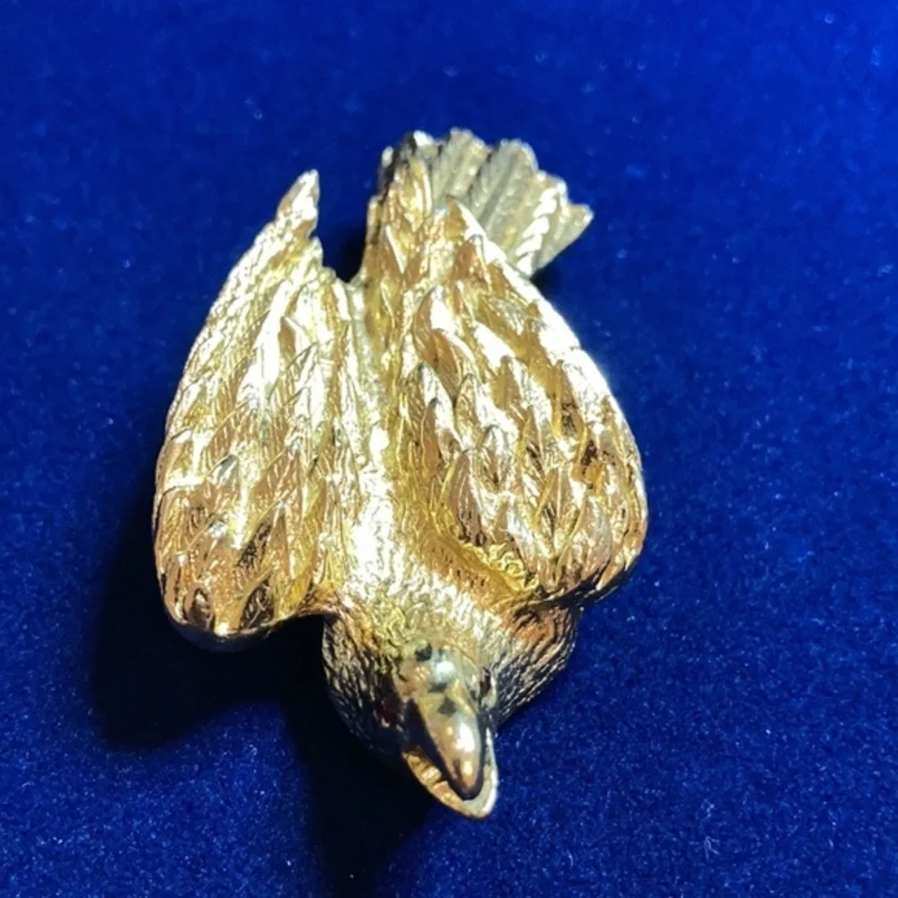 Vintage ‘60s gold tone Nesting eagle with red rhinestones
